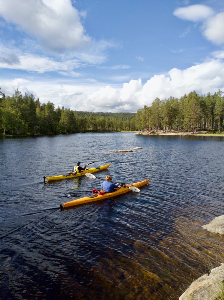 Two people kayaking on a lake