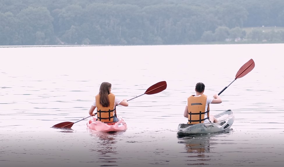 Two women kayaking on a lake